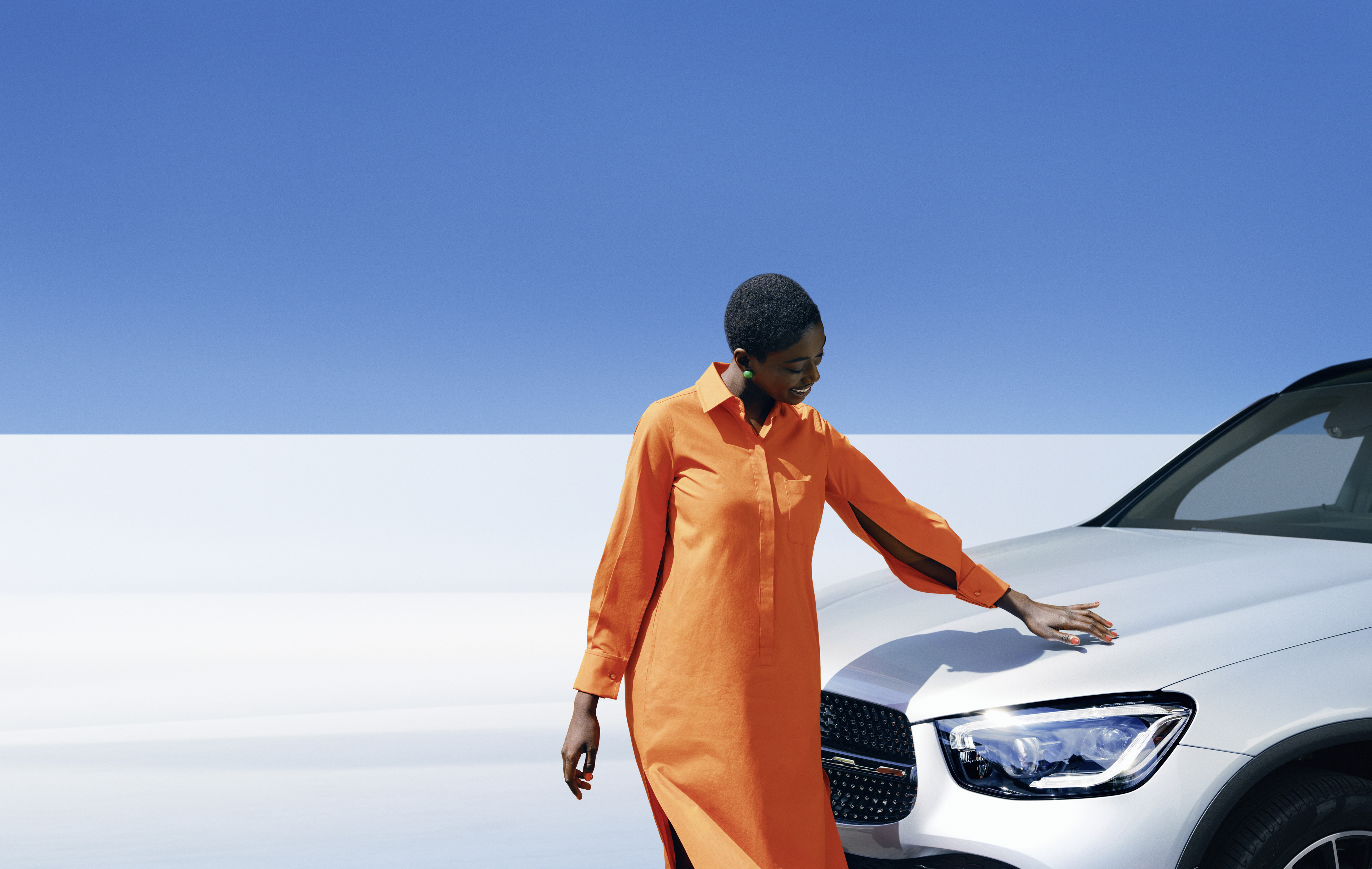 Original Car Care | Mercedes-Benz A woman inspecting her Mercedes-Benz