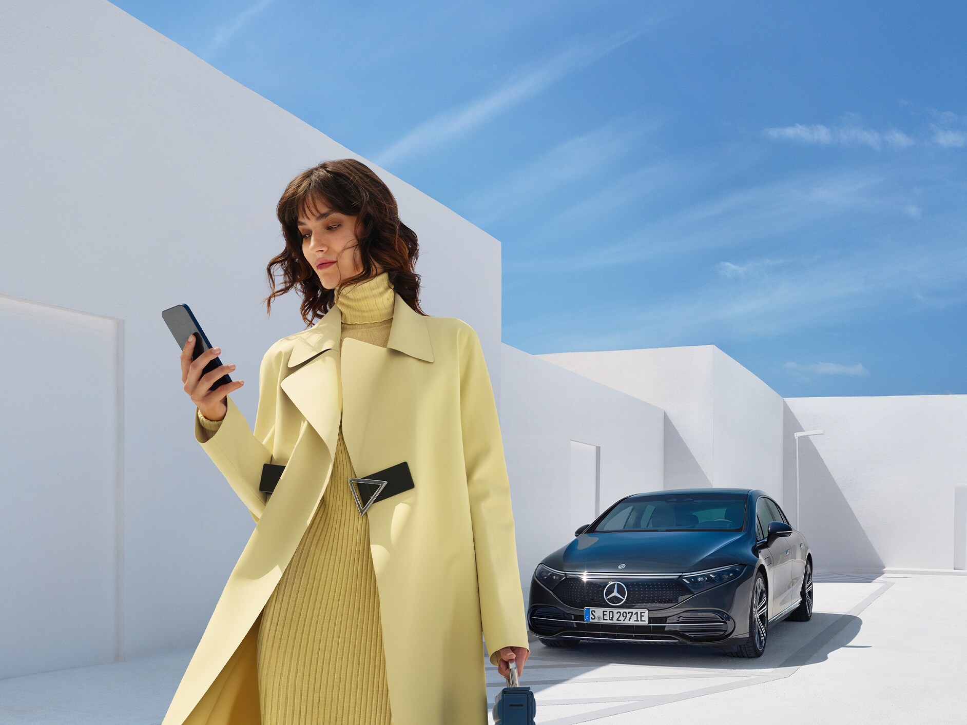 Person extending / purchasing Digital Extras for a vehicle using a smartphone.