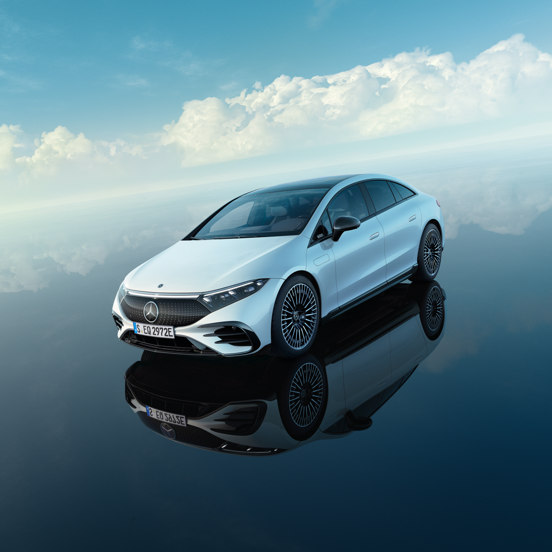 Rigorous inspection A white Mercedes EQ stands under a bright blue sky.
