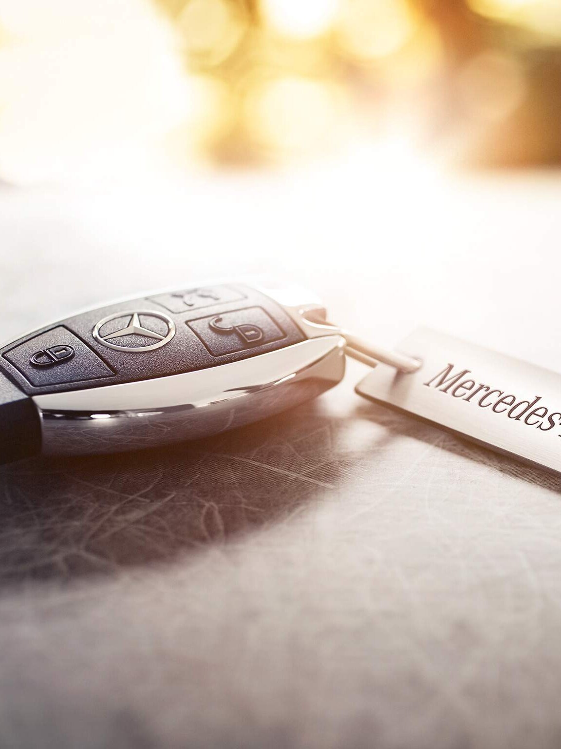 Close-up of a Mercedes-Benz car key – Exclusive privileges for corporates and key professional groups