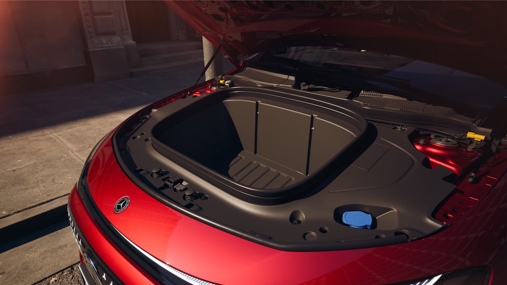 Front storage compartment of the Mercedes-Benz CLA 200 Electric with the hood open.
